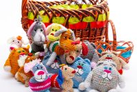aap-top-handmade-gifts-for-teachers-that-they-actually-want-1790877656 Adorable handmade crochet animal toys displayed with a festive basket, perfect for gift-giving occasions.