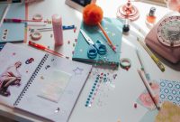 aap-unique-diy-gift-ideas-for-crafters-on-a-budget-1790866589 A vibrant workspace filled with crafting materials, stationery, and decorative items promoting creativity.